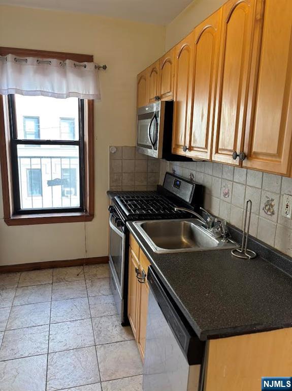 6209 Boulevard, Unit 1EN West New York, NJ 07093 - Photo 11 of 13 a kitchen that has a sink and a stove