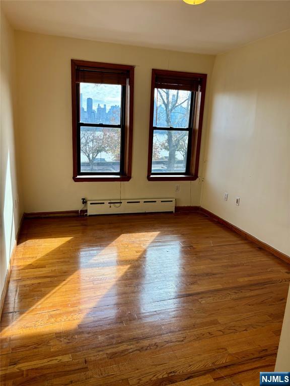 6209 Boulevard, Unit 1EN West New York, NJ 07093 - Photo 7 of 13 a view of room with window and wooden floor