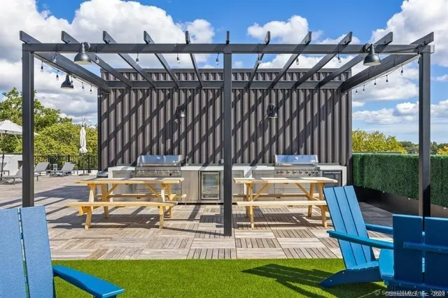 a view of swimming pool with seating space