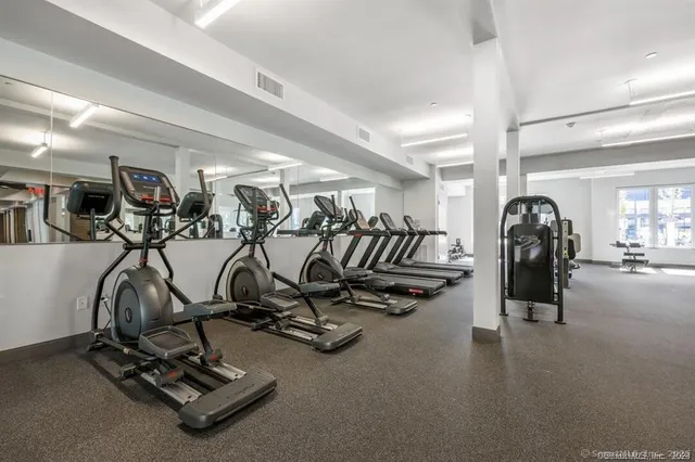 a room with lots of table chair