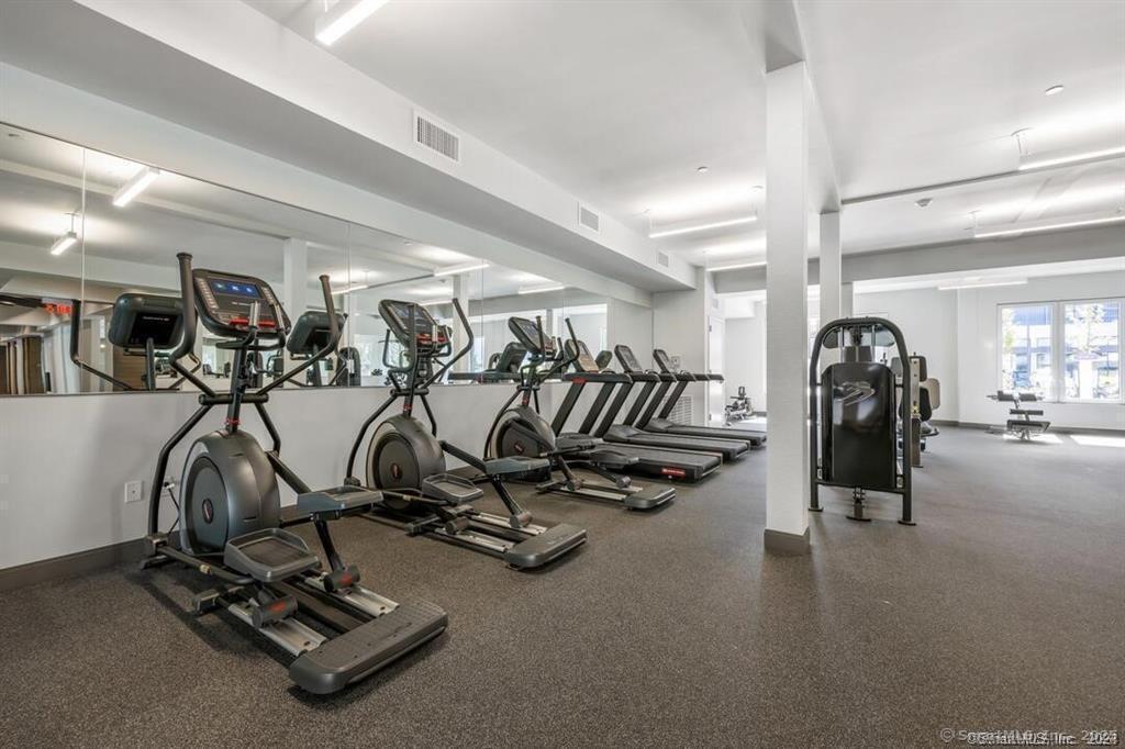 10 A Willard Road, Unit 456 Norwalk, CT 06851 - Photo 10 of 29 a view of a room with gym equipment