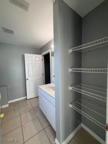 a view of an empty walk in closet