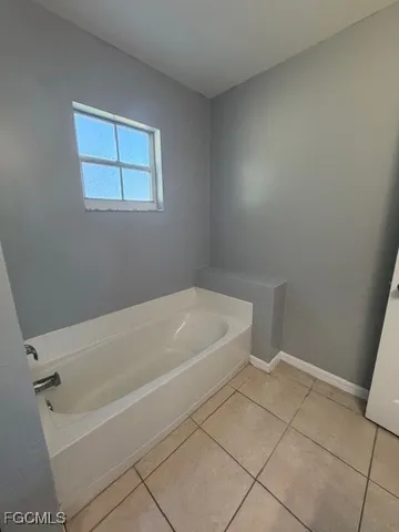 a white bath tub sitting in a bathroom