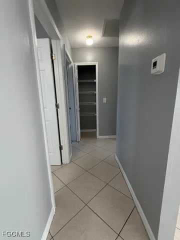 a view of hallway with walk in closet