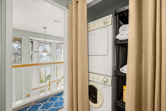 a living room with furniture a couch and next to a window