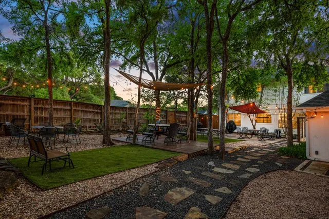a view of a backyard with tree s