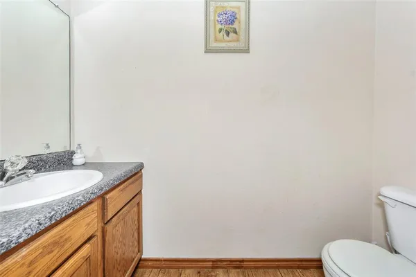 a bedroom with a bed and a dresser in it