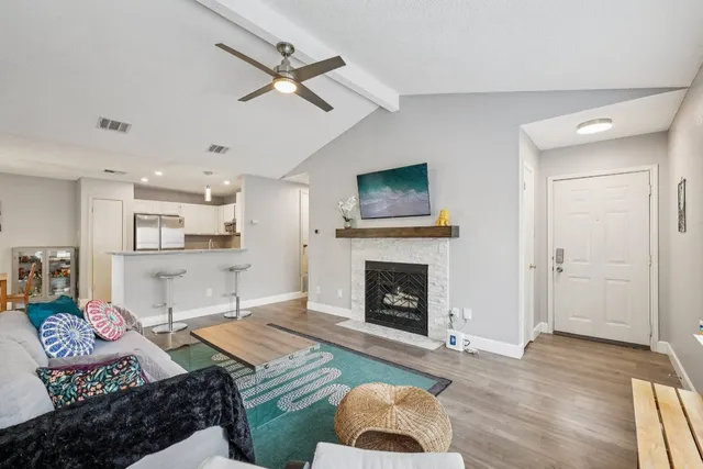 a living room with furniture and a fireplace