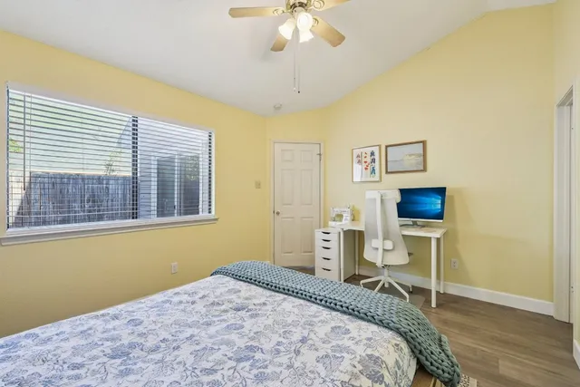 a bedroom with a bed and a chair