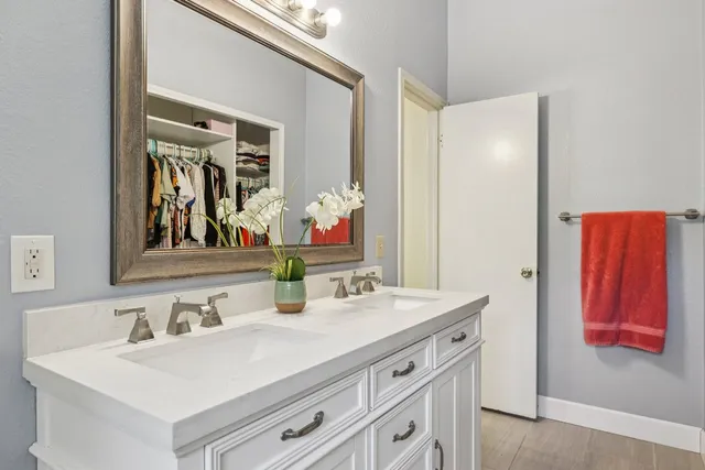a bathroom with a sink and a mirror