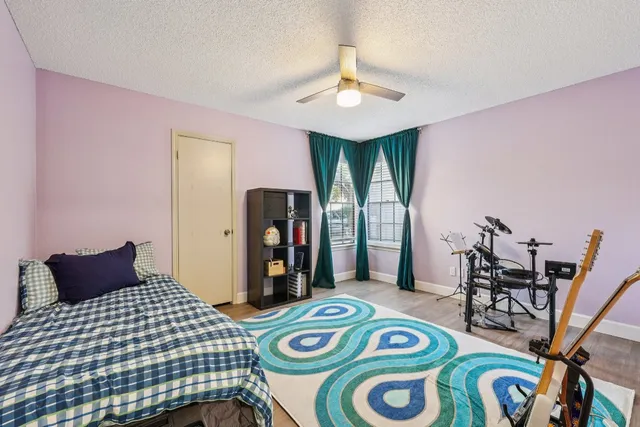 a bedroom with furniture and a chandelier