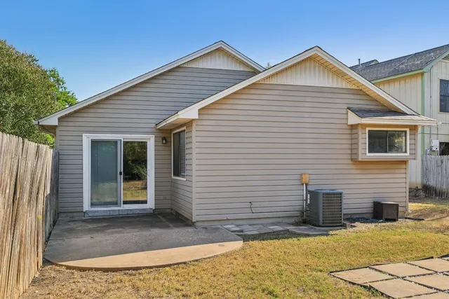 a view of a house with small yard