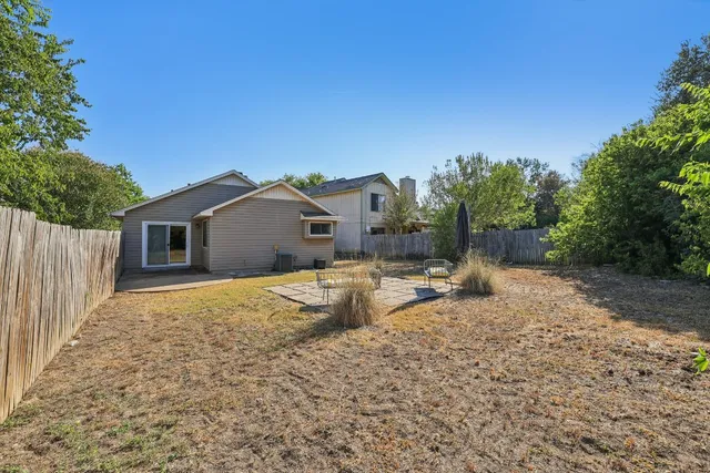a house view with a backyard space