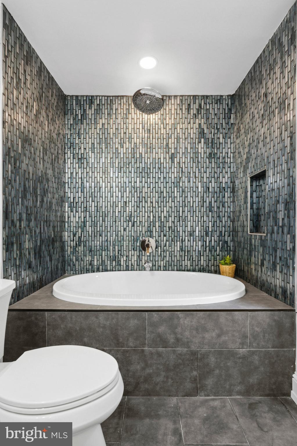 1716 Spruce Street, Unit 8 Philadelphia, PA 19103 - Photo 11 of 13 a bathroom with a toilet and a shower