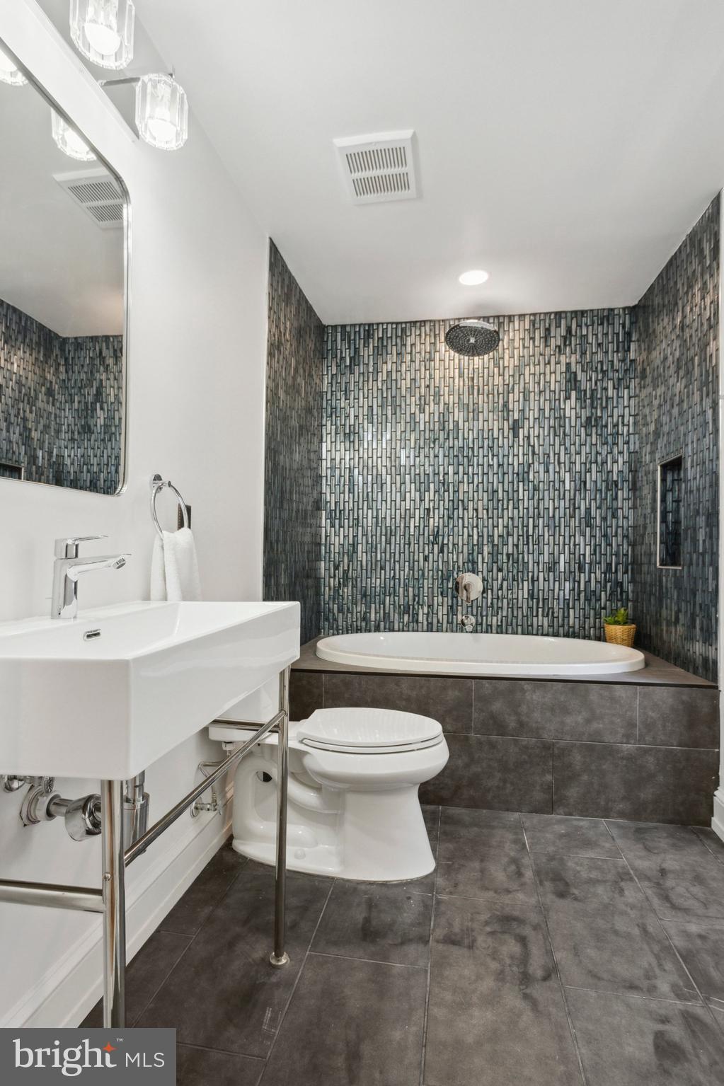 1716 Spruce Street, Unit 8 Philadelphia, PA 19103 - Photo 10 of 13 a bathroom with a sink toilet and shower