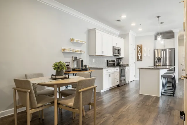 a kitchen with a table and chairs in it