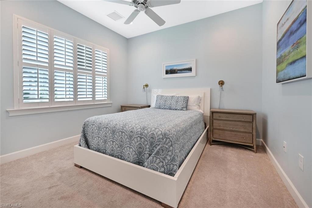 4909 Andros Drive Naples, FL 34113 - Photo 15 of 33 a bedroom with a bed and a window