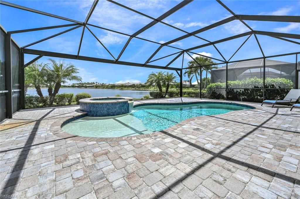 4909 Andros Drive Naples, FL 34113 - Photo 23 of 33 a view of a backyard with plants and patio