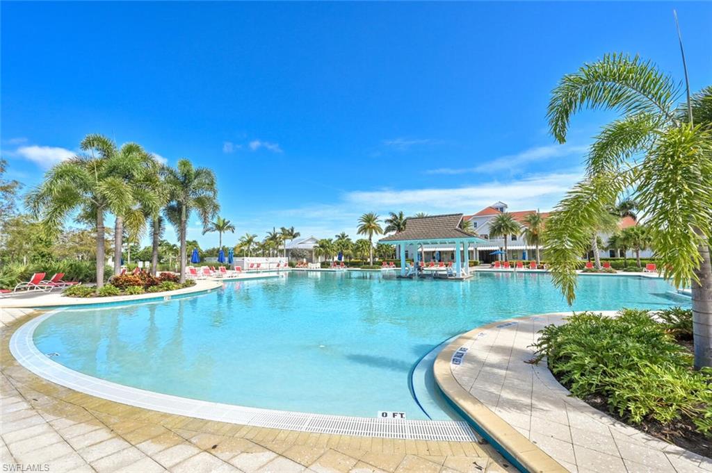4909 Andros Drive Naples, FL 34113 - Photo 27 of 33 a view of a swimming pool with a lake view