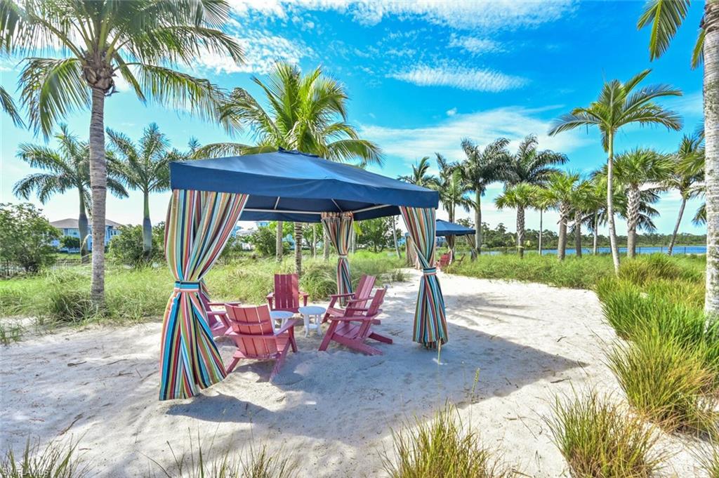 4909 Andros Drive Naples, FL 34113 - Photo 28 of 33 a view of a backyard with a sitting area