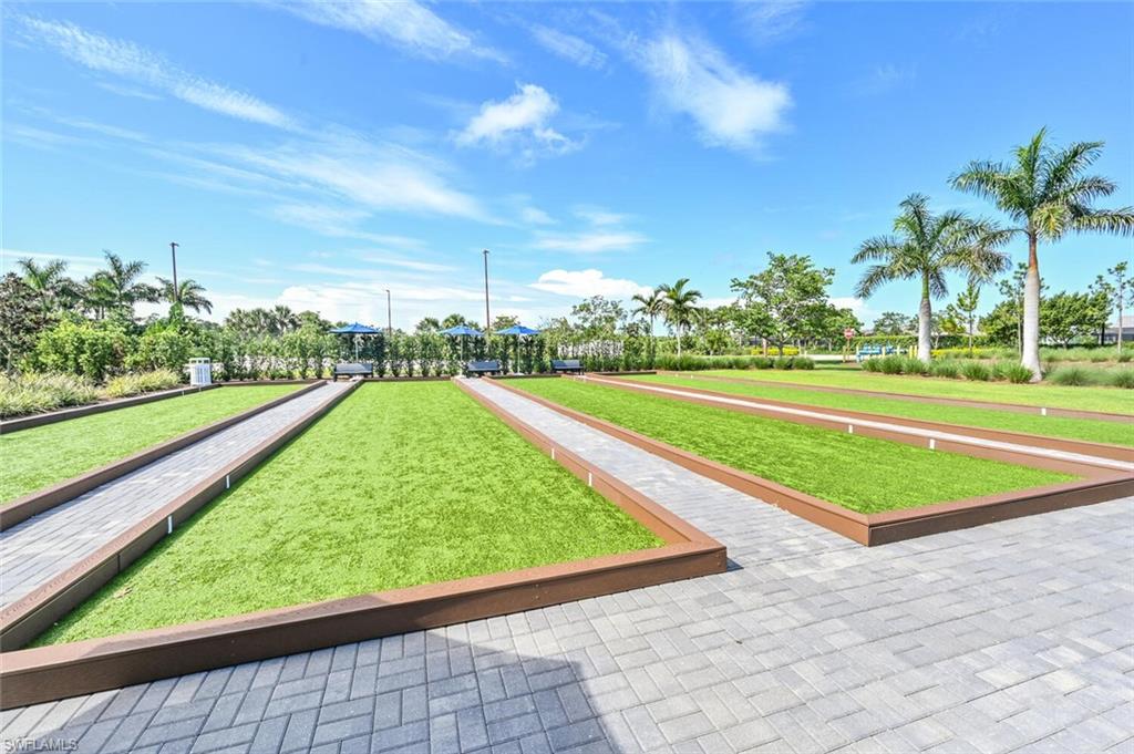 4909 Andros Drive Naples, FL 34113 - Photo 29 of 33 a view of a swimming pool and a yard
