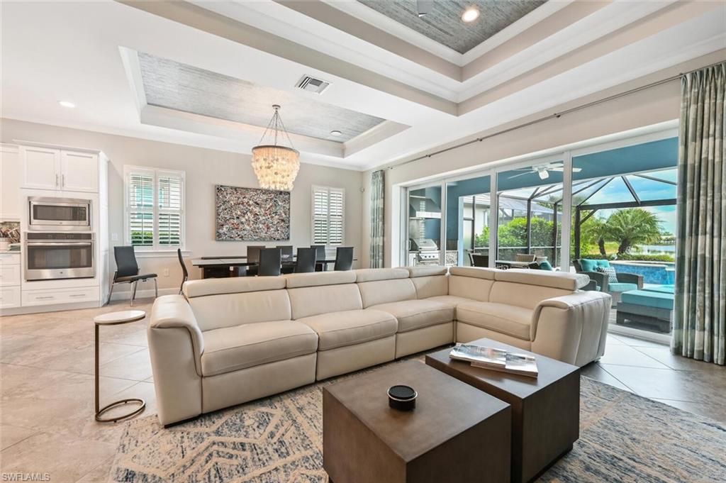 4909 Andros Drive Naples, FL 34113 - Photo 6 of 33 a living room with furniture and a large window