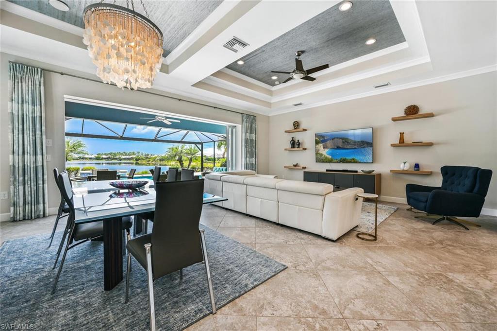 4909 Andros Drive Naples, FL 34113 - Photo 7 of 33 a living room with furniture and a large window