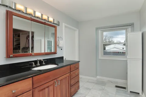 a bathroom with a sink and a mirror
