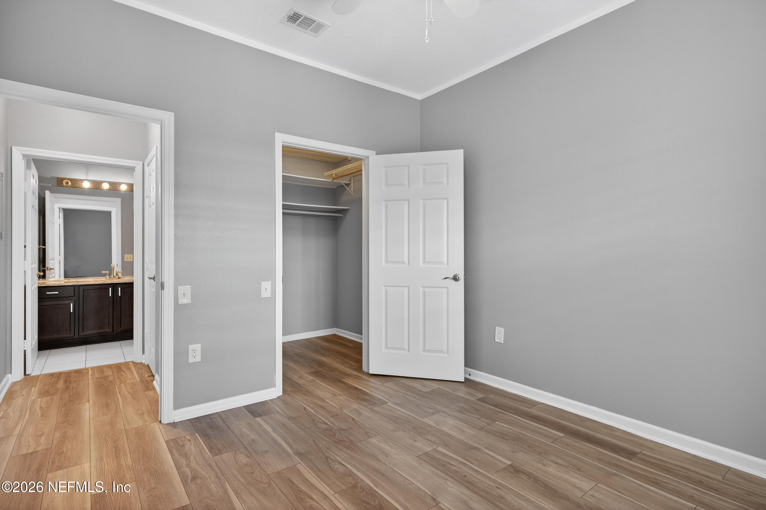10550 Baymeadows Road, Unit 912 Jacksonville, FL 32256 - Photo 16 of 21 a view of an empty room with wooden floor and a bathroom
