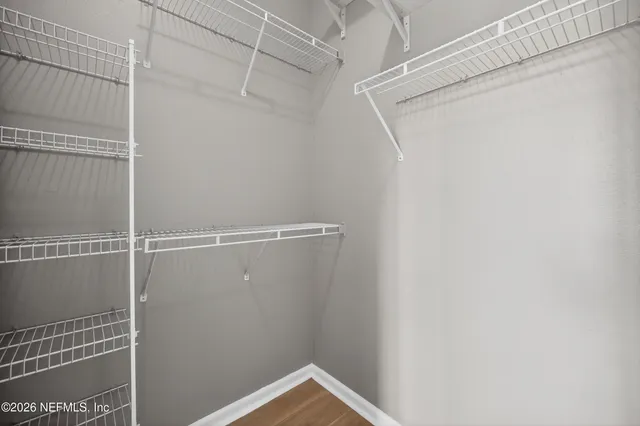 a view of a livingroom with wooden cabinets