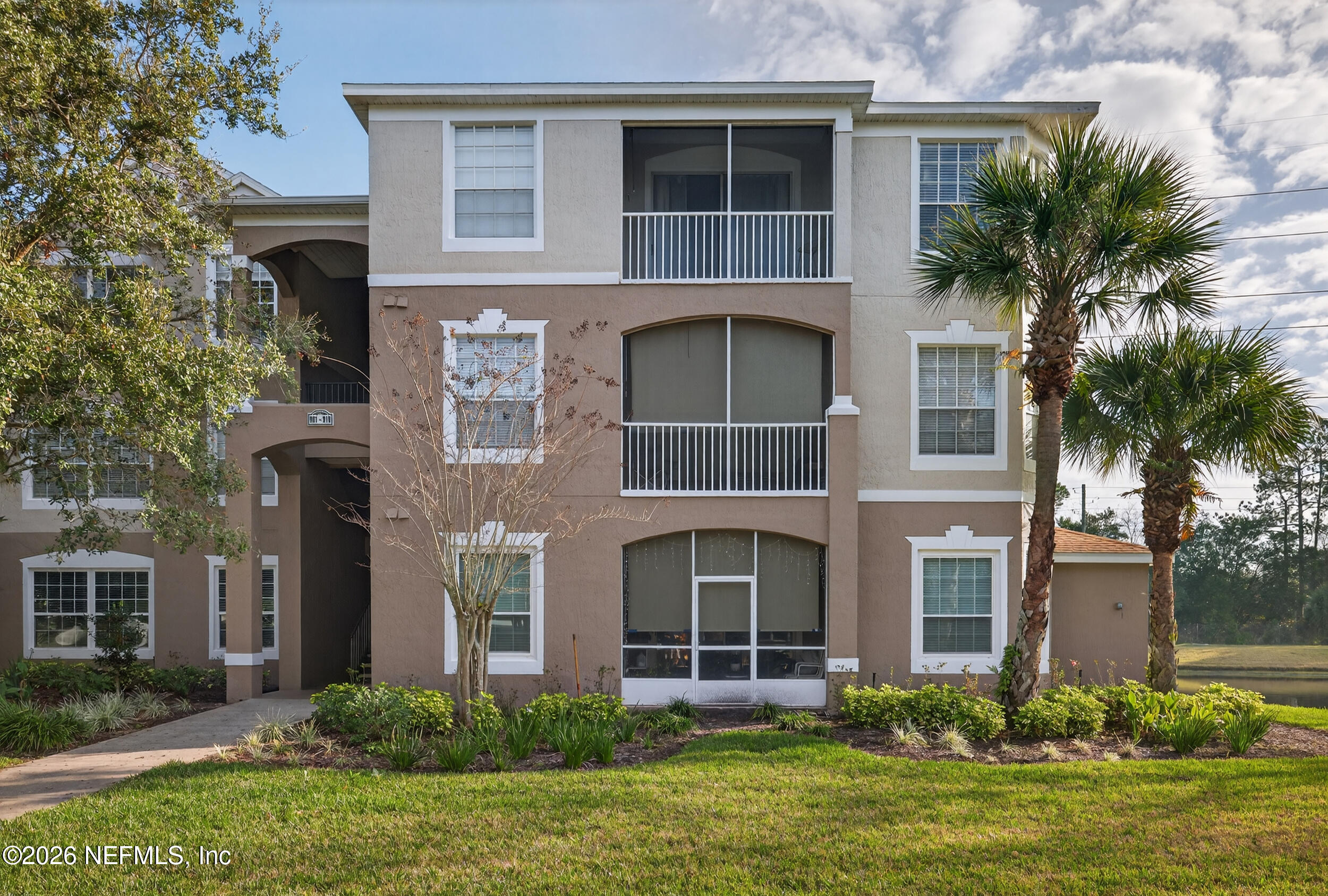 10550 Baymeadows Road, Unit 912 Jacksonville, FL 32256 - Photo 2 of 21 a front view of house with yard and green space