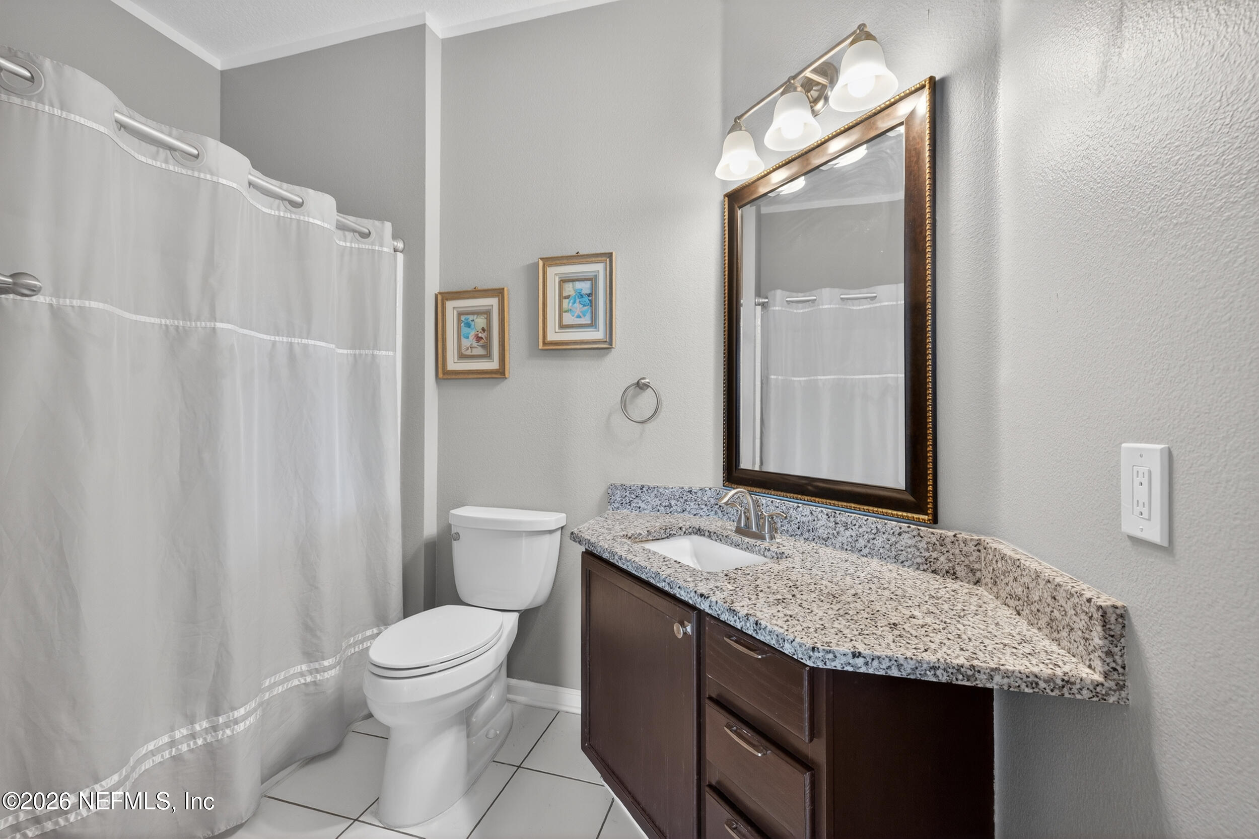 10550 Baymeadows Road, Unit 912 Jacksonville, FL 32256 - Photo 21 of 21 a bathroom with a granite countertop sink toilet and shower