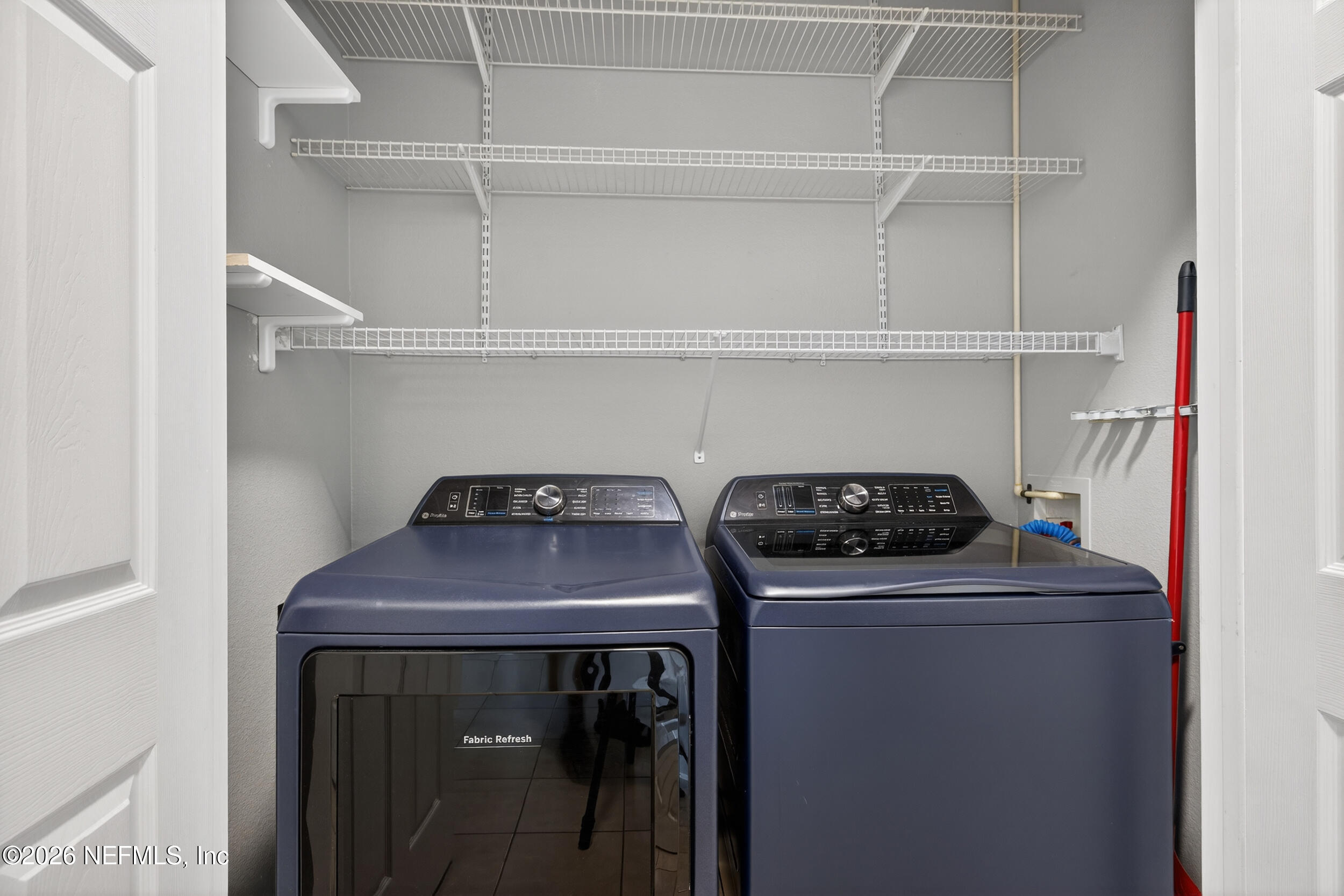 10550 Baymeadows Road, Unit 912 Jacksonville, FL 32256 - Photo 8 of 21 a utility room with dryer and washer