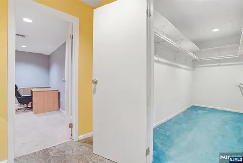 a bathroom with a granite countertop sink mirror and toilet