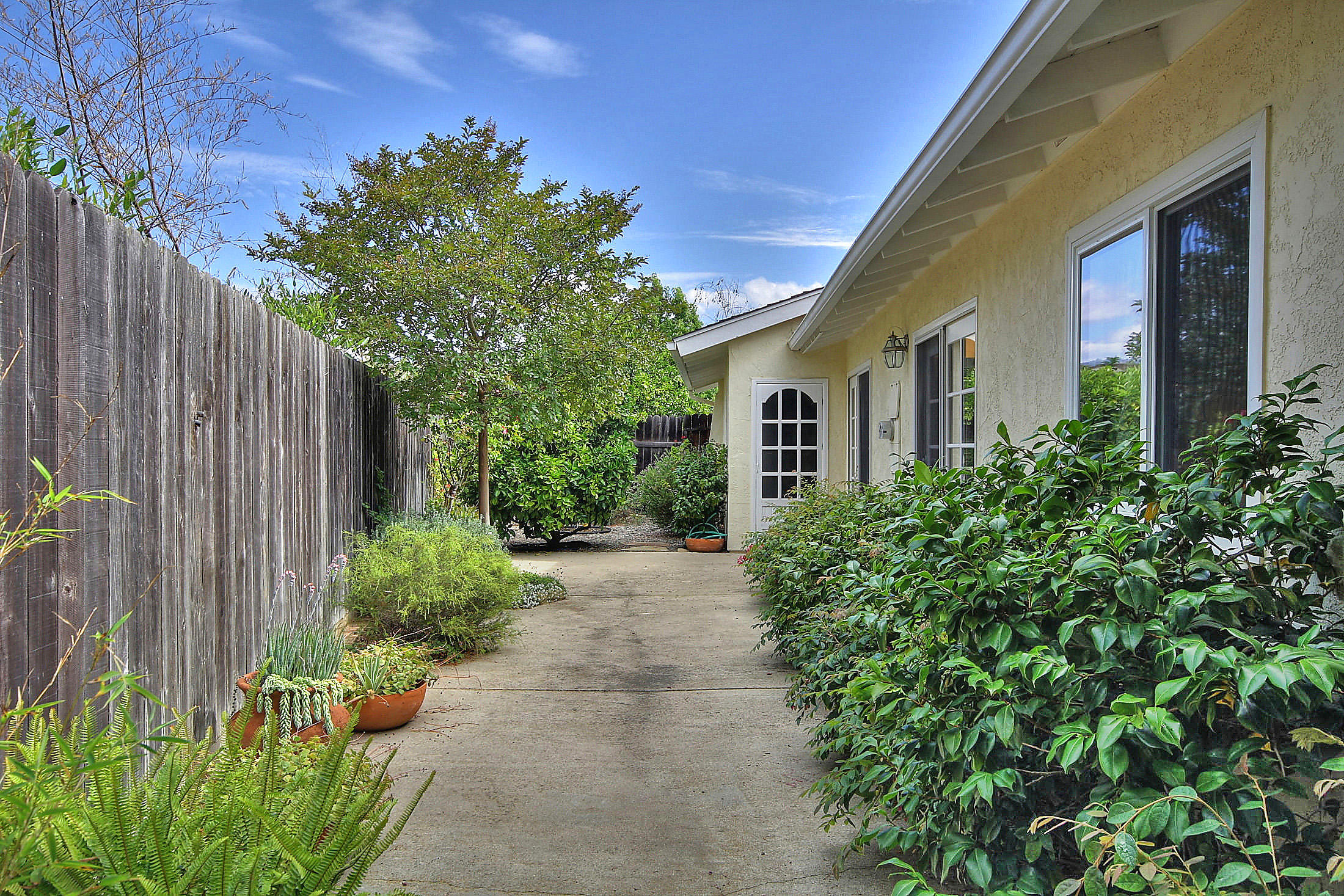 867 Via Abajo Santa Barbara, CA 93110 - Photo 13 of 26 a front view of a house with a yard