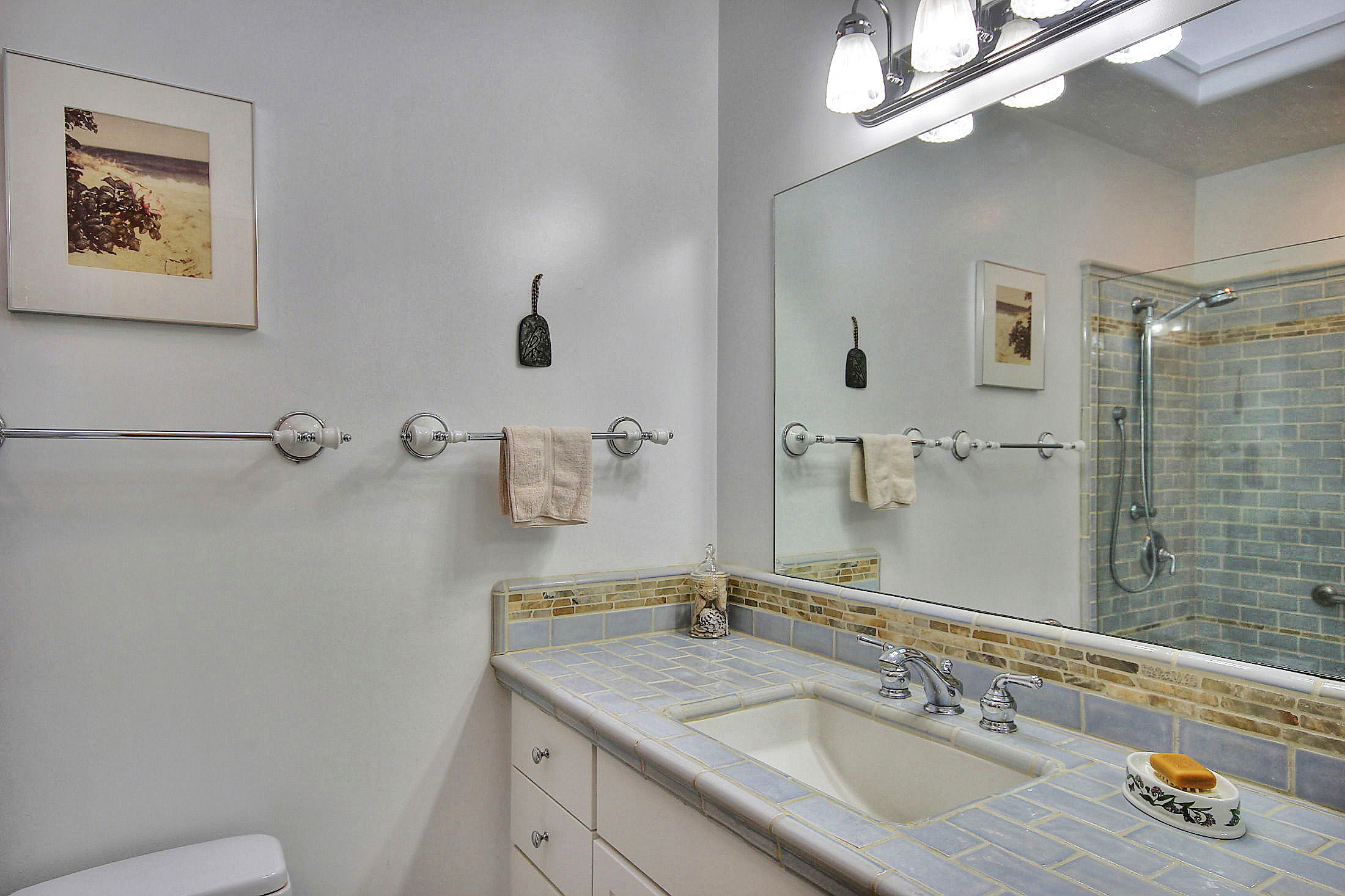 867 Via Abajo Santa Barbara, CA 93110 - Photo 16 of 26 a bathroom with a sink vanity granite and toilet