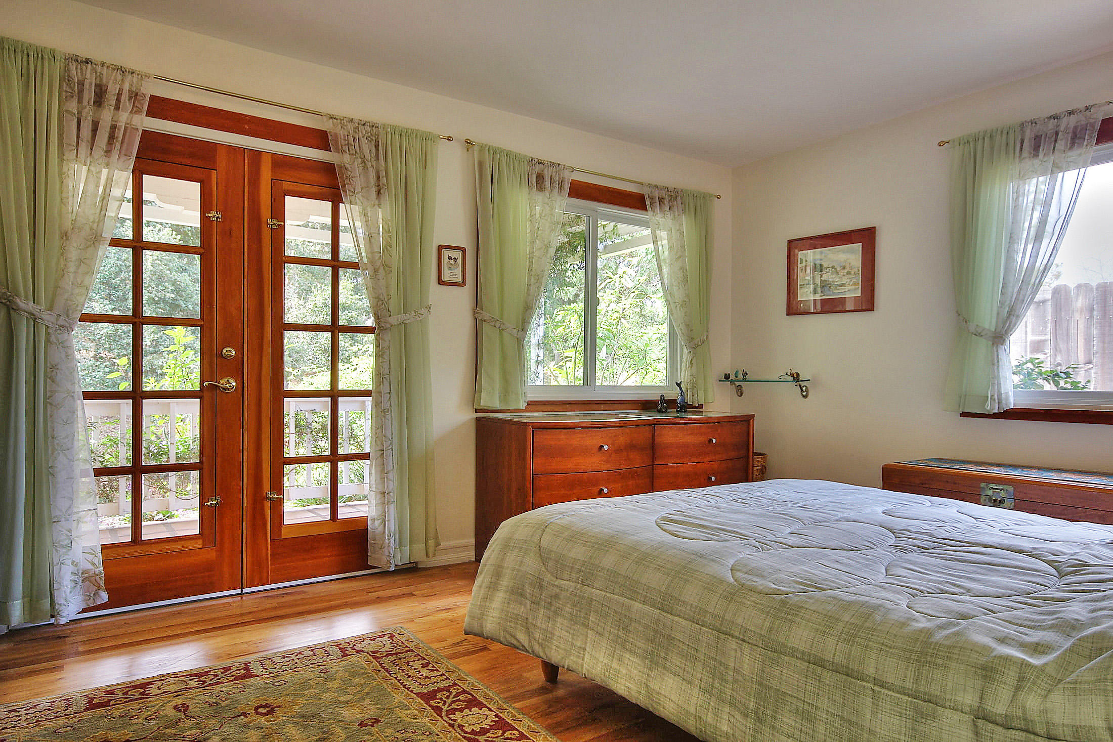 867 Via Abajo Santa Barbara, CA 93110 - Photo 19 of 26 a bedroom with a large bed and a window