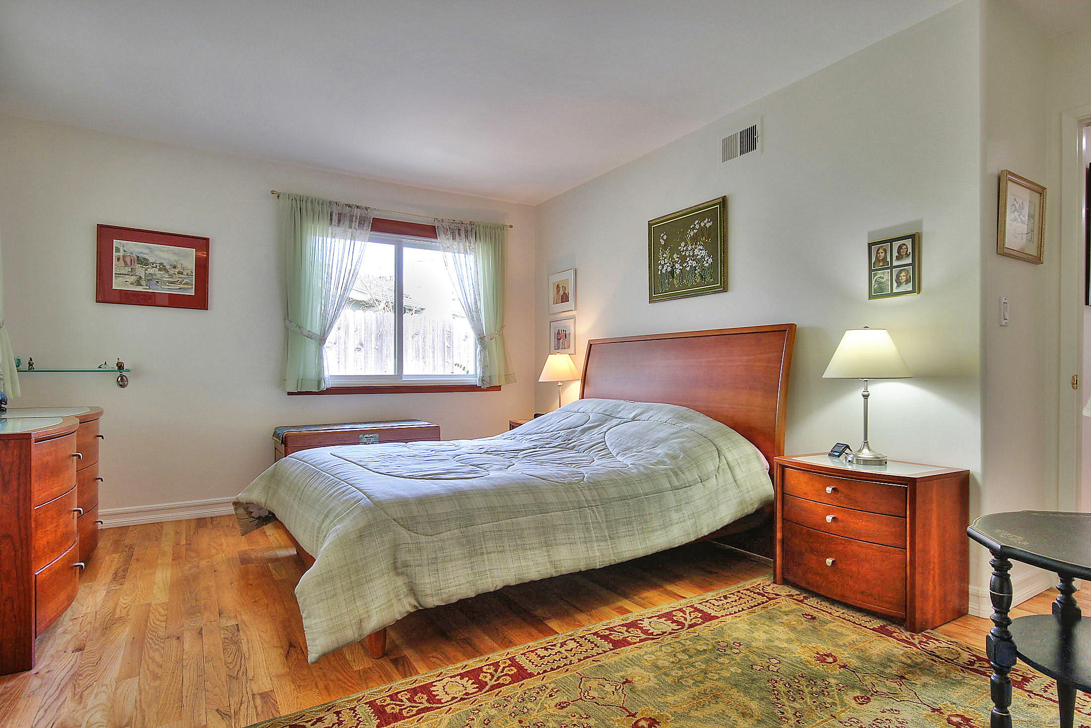 867 Via Abajo Santa Barbara, CA 93110 - Photo 20 of 26 a bedroom with a bed and a lamp on dresser