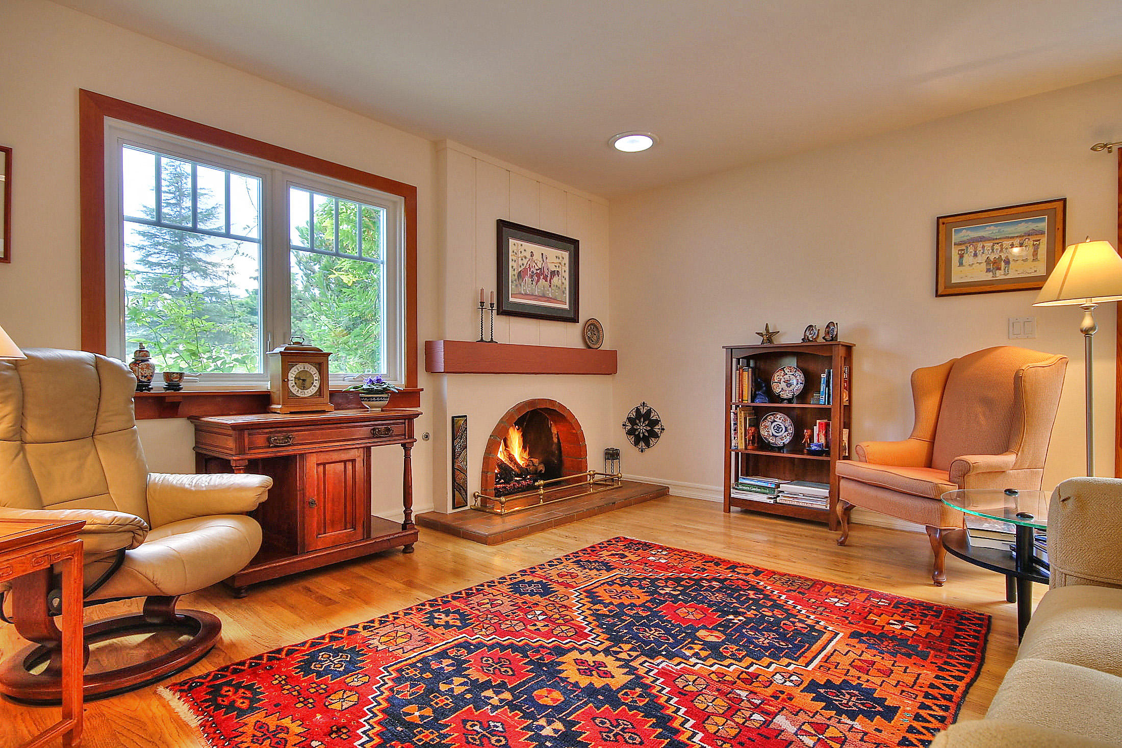 867 Via Abajo Santa Barbara, CA 93110 - Photo 2 of 26 a living room with furniture a rug and a fireplace