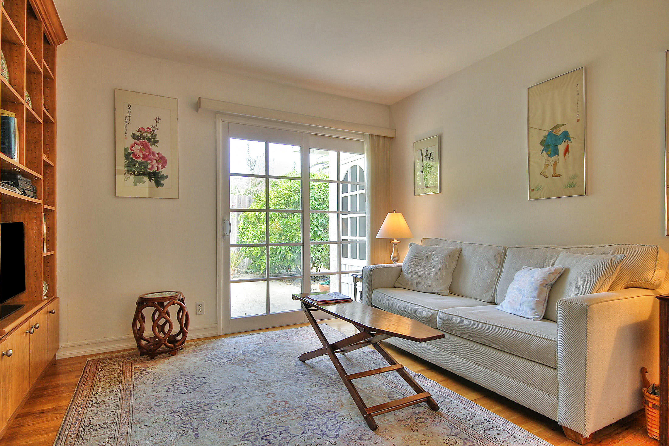 867 Via Abajo Santa Barbara, CA 93110 - Photo 22 of 26 a living room with furniture a flat screen tv and a window