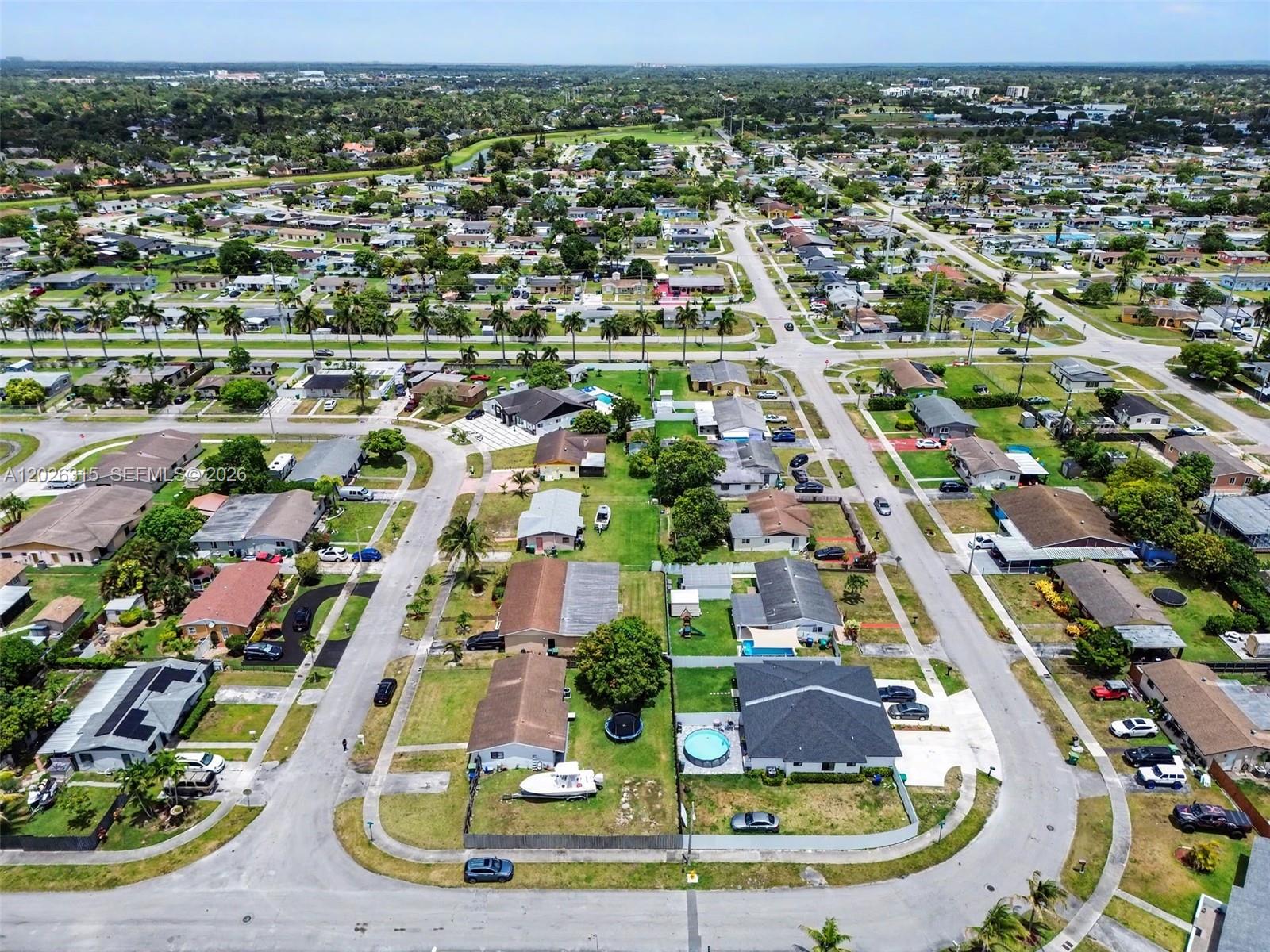 10762 Southwest 145th Street Miami, FL 33176 - Photo 5 of 28 an aerial view of residential houses with outdoor space