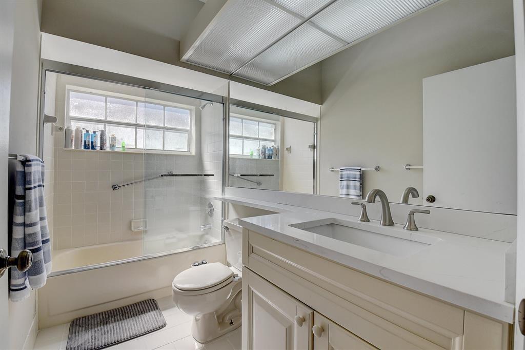 7769 Mansfield Hollow Road Delray Beach, FL 33446 - Photo 17 of 18 a bathroom with a sink toilet and shower