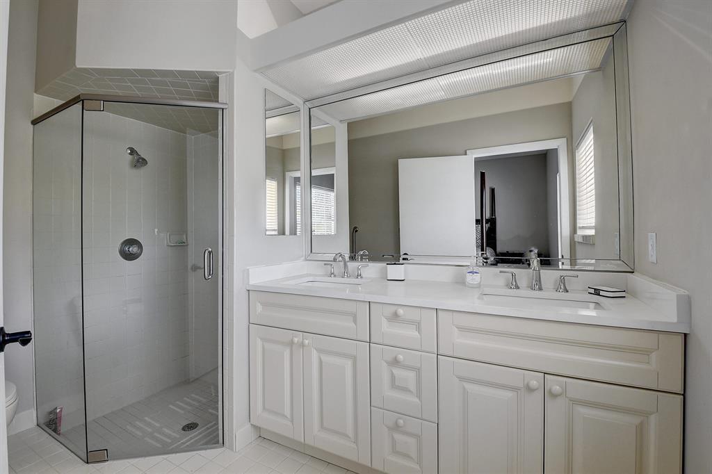 7769 Mansfield Hollow Road Delray Beach, FL 33446 - Photo 18 of 18 a bathroom with a double vanity sink mirror and shower