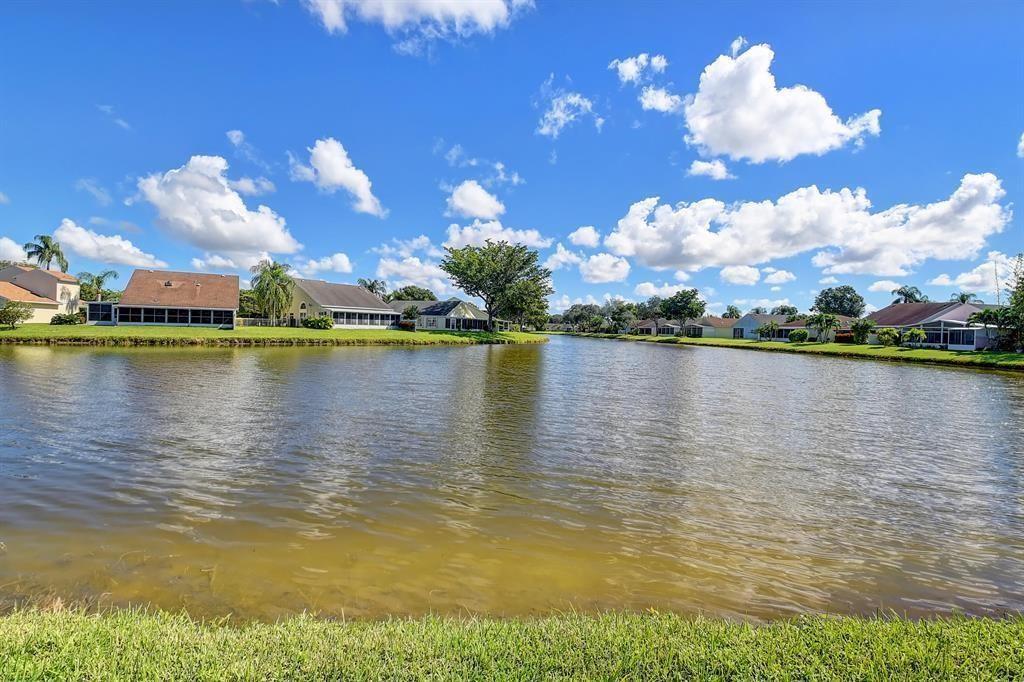 7769 Mansfield Hollow Road Delray Beach, FL 33446 - Photo 4 of 18 a view of a lake with a city view