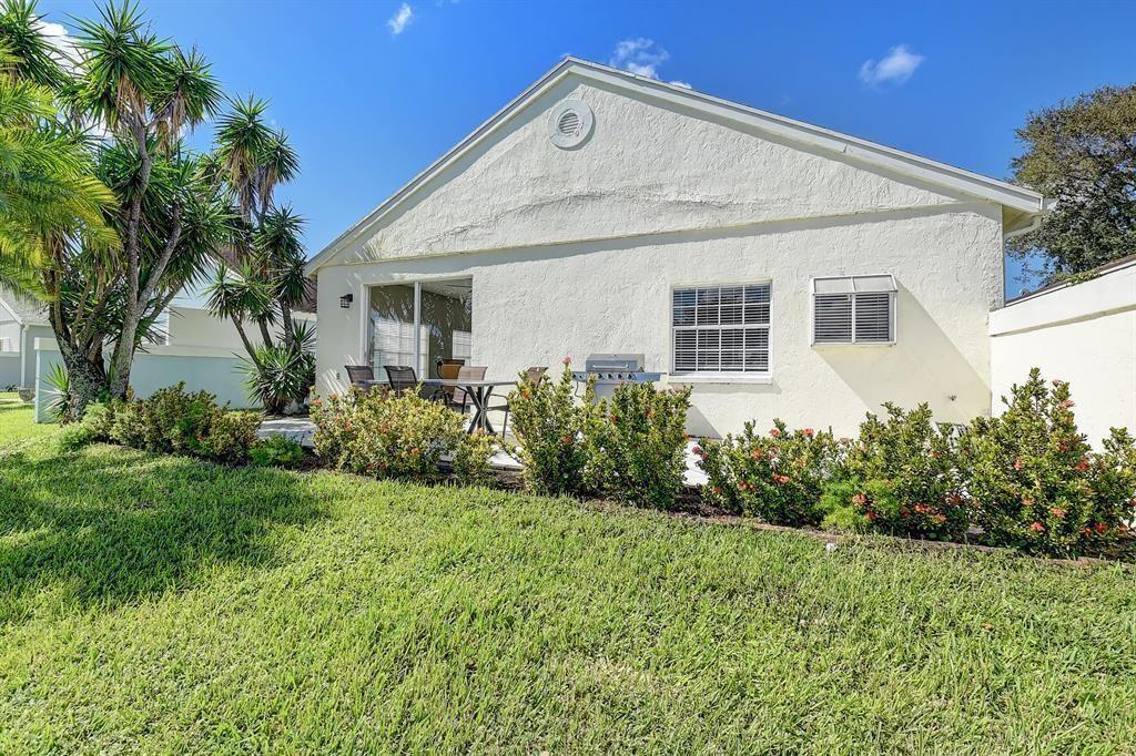 7769 Mansfield Hollow Road Delray Beach, FL 33446 - Photo 5 of 18 a view of a house with garden