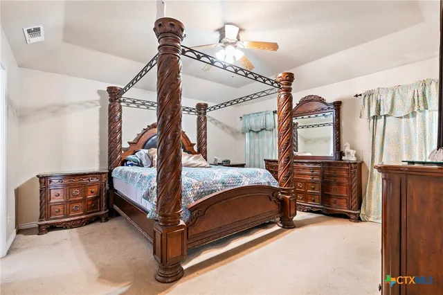 a bathroom with a tub and next to a window