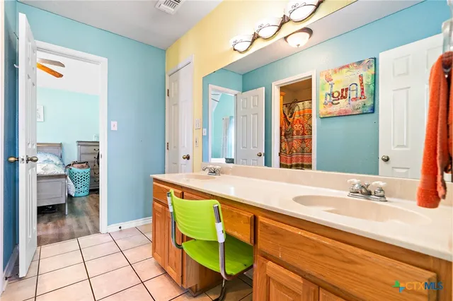 a bathroom with a toilet and a sink