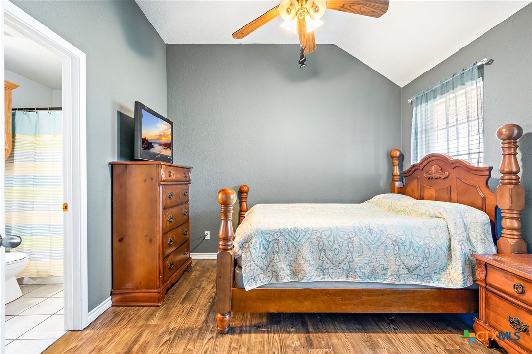 155 Western Ridge Road Gatesville, TX 76528 - Photo 25 of 26 a bedroom with a bed and wooden floor