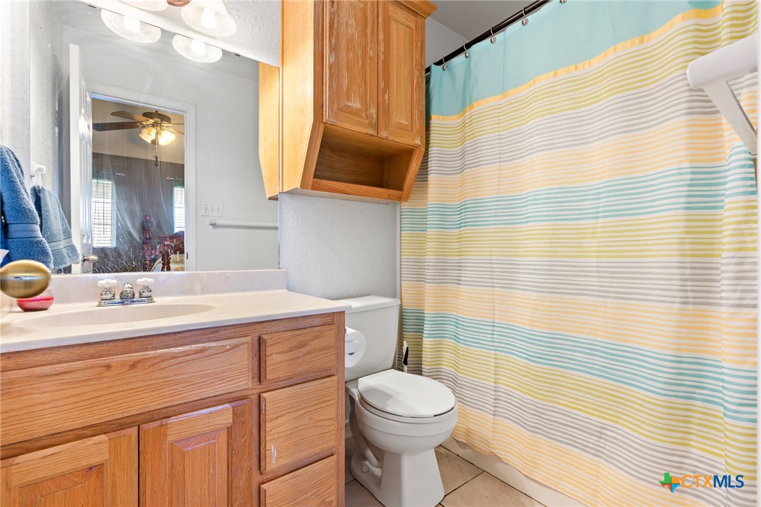 155 Western Ridge Road Gatesville, TX 76528 - Photo 26 of 26 a bathroom with a sink toilet and shower