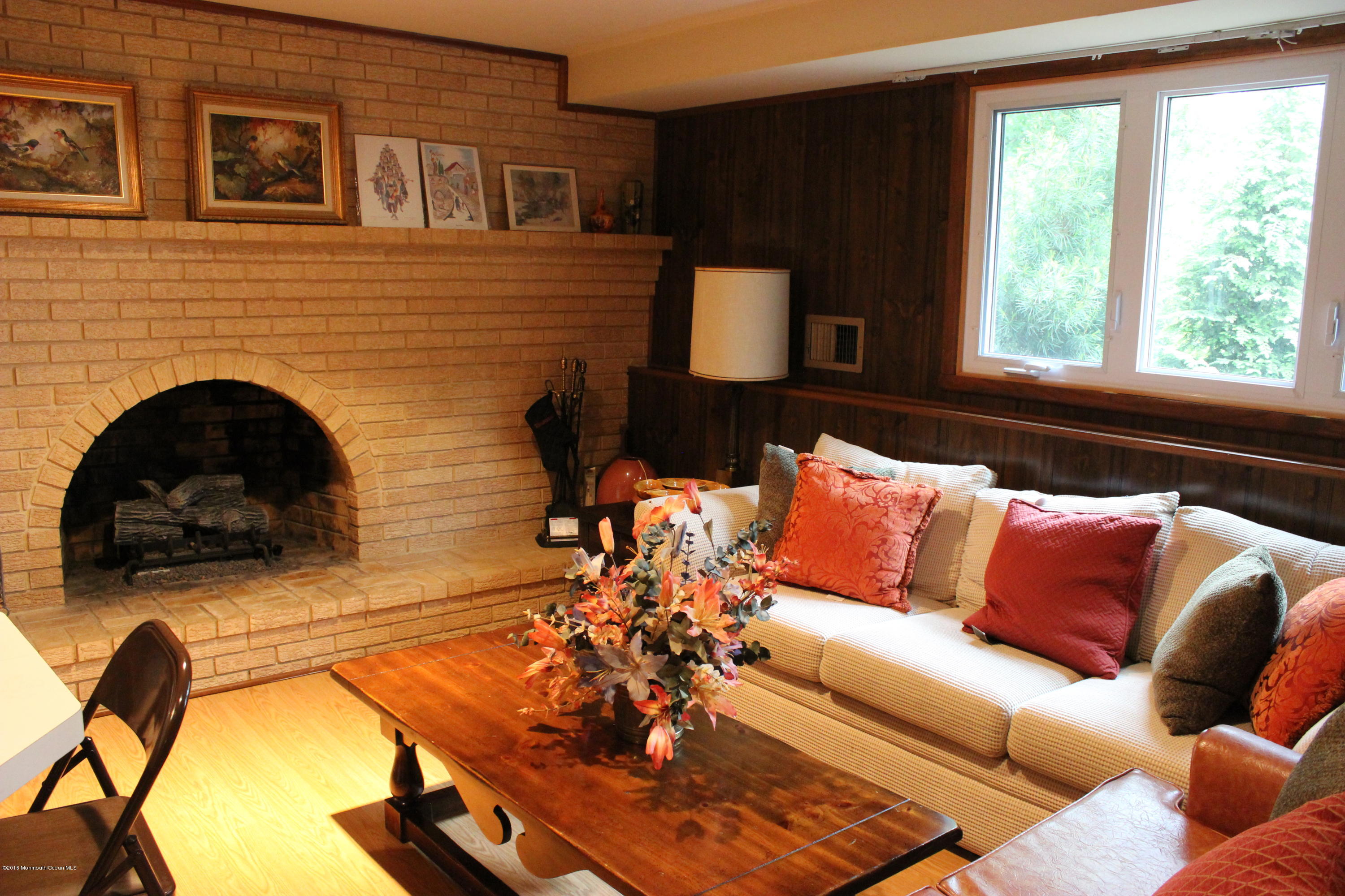 3 Sunnyside Road Howell, NJ 07731 - Photo 20 of 28 a living room with furniture and a fireplace
